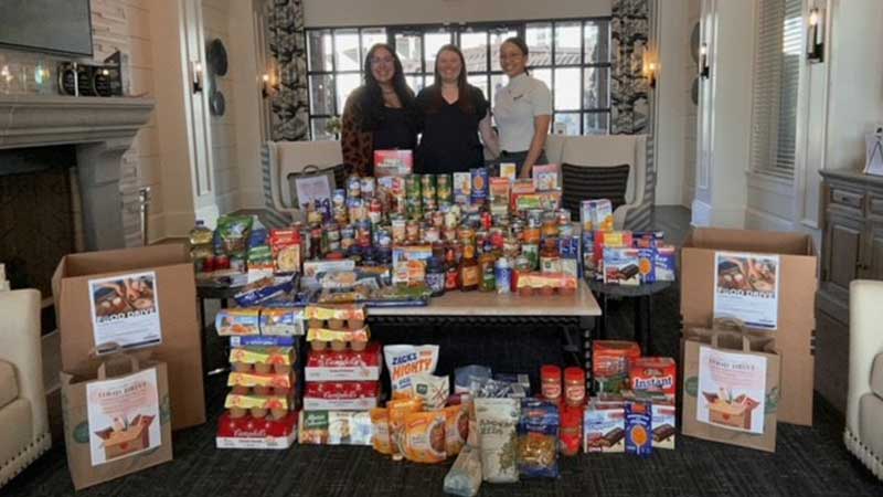 Abberly Market Point team with food donations